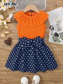 00068 Girls' outfit, polka dot blouse and skirt