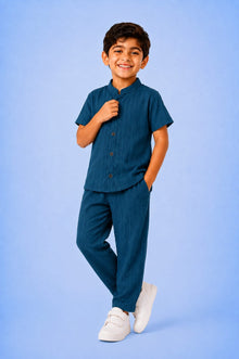 00057 She sewed a two-piece outfit for my children: a button-down shirt and trousers.